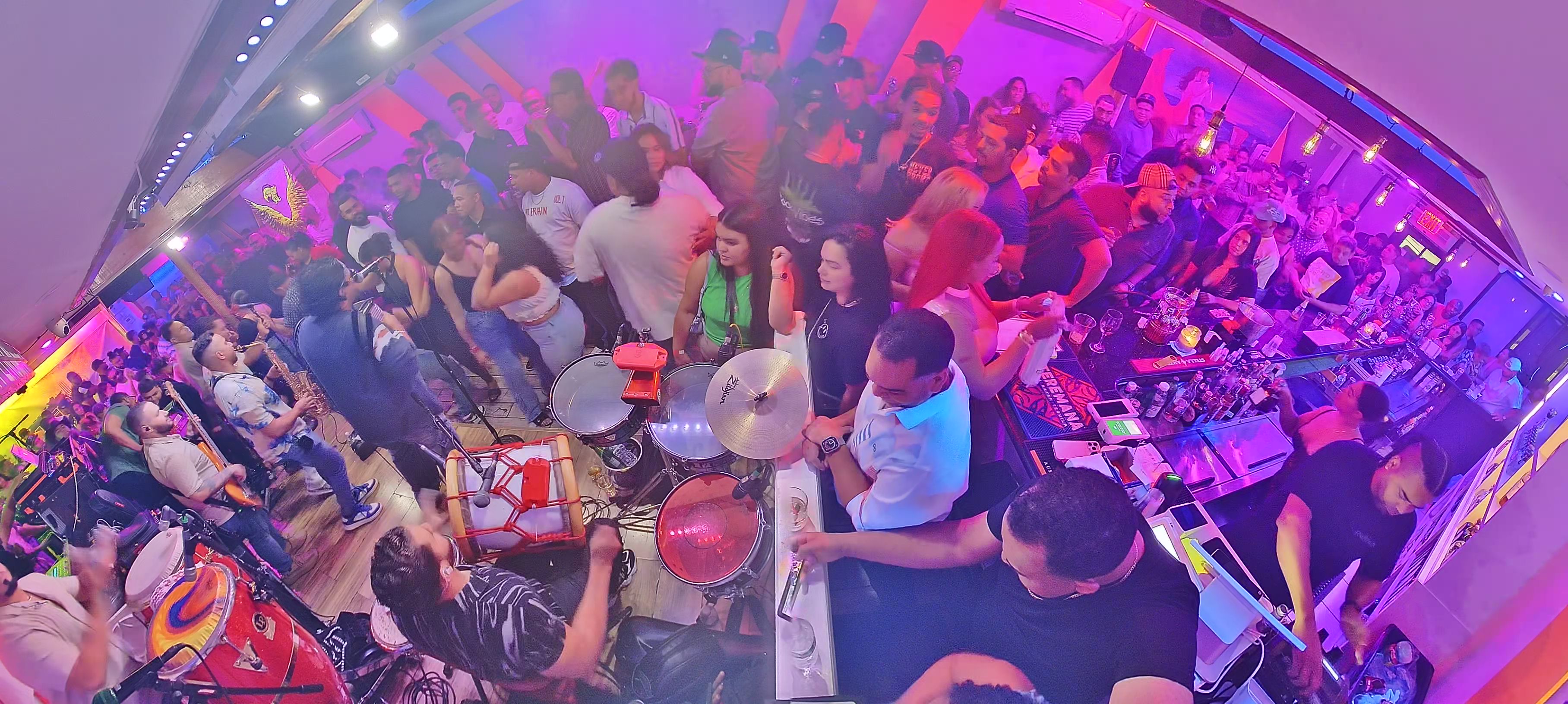 Guests dancing to Latin music at Lugo Lounge