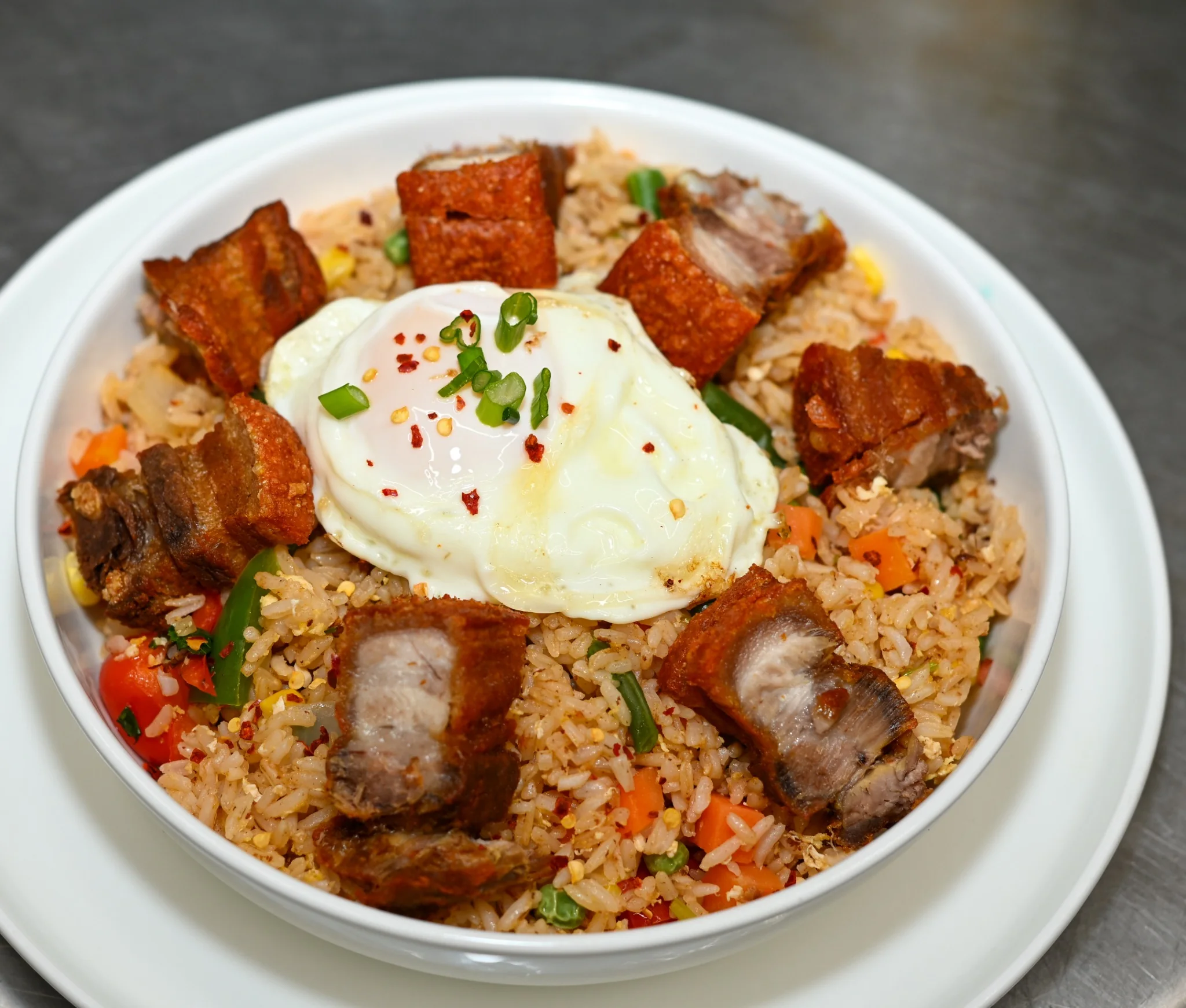 Pork Belly Fried Rice house best seller at Lugo's Lounge
